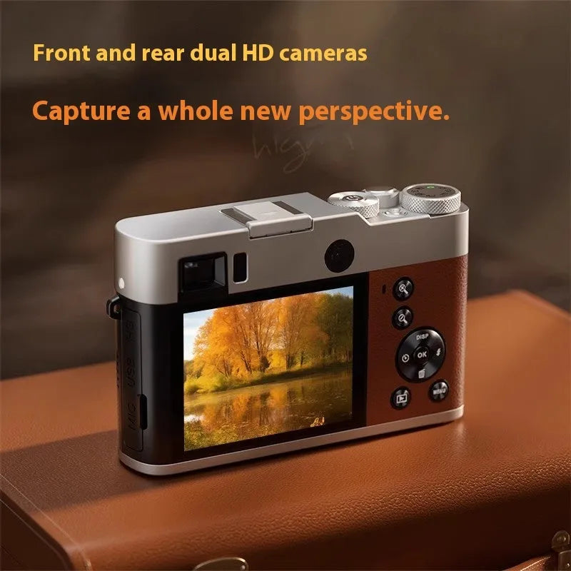 Black 5K HD digital camera with front and rear lenses, optical viewfinder, and 2.88-inch screen on a table.