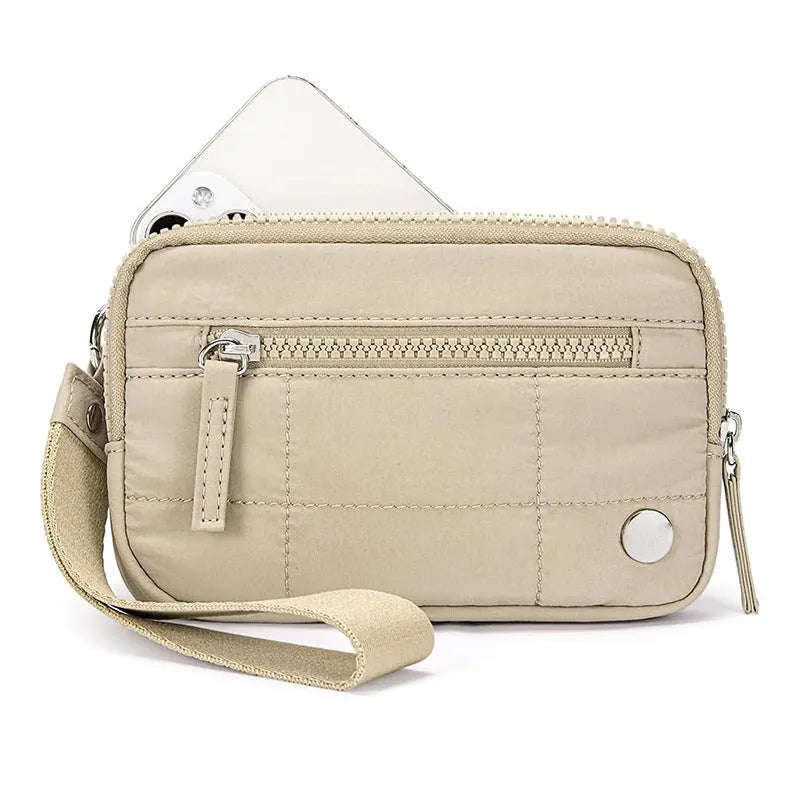 Waterproof quilted women's handbag with transparent deck panel in solid colour nylon
