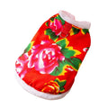 Red winter dog vest with plush lining, metal D-ring, and large floral peony pattern on a small dog