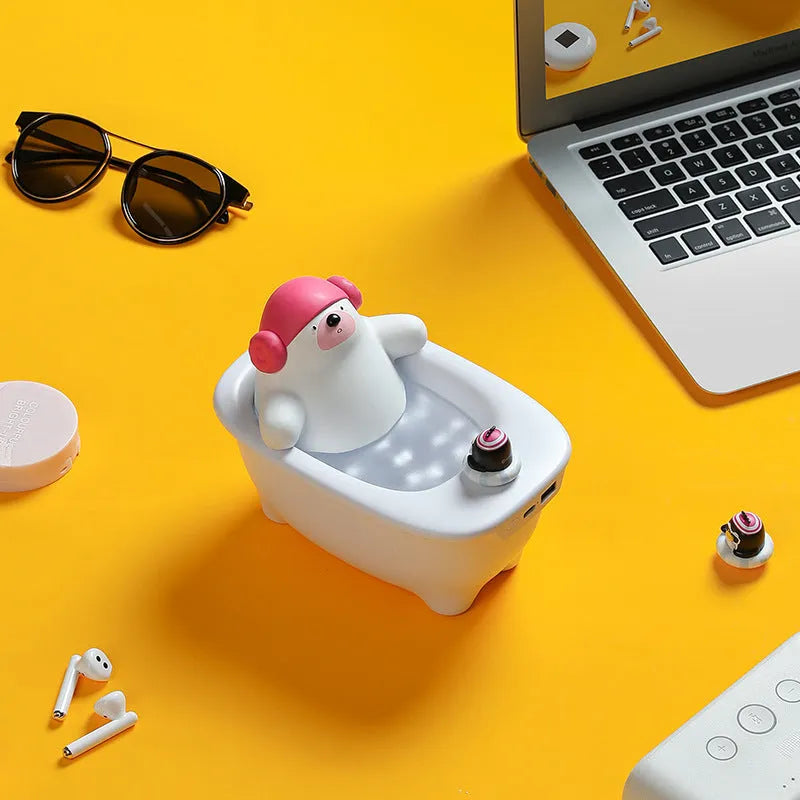 White USB air humidifier with large water tank on a desk next to a laptop.