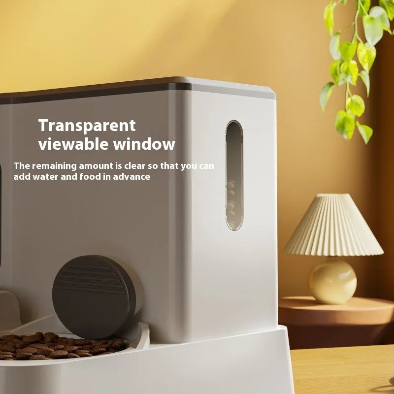 Grey automatic cat feeder and water dispenser unit with two bowls.