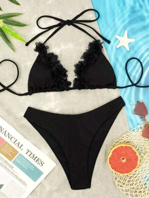 Black women's gathered two-piece polyester swimsuit bikini set on a mannequin