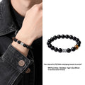 Men's obsidian bracelet with pure silver elements and six-word mantra prayer wheel design