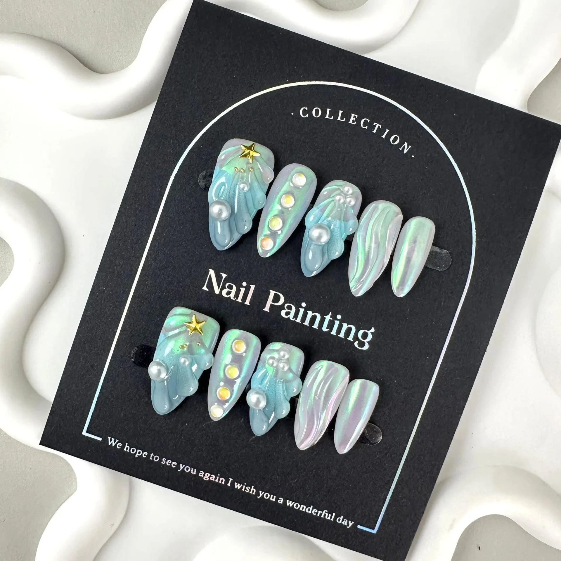 Blue summer design plastic false nail stickers in XS, S, M, L sizes.