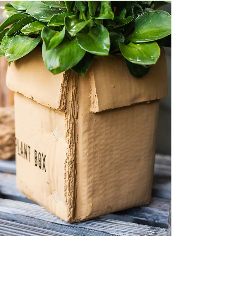 Cement flowerpot with perforated base and imitation carton paper texture for indoor planting