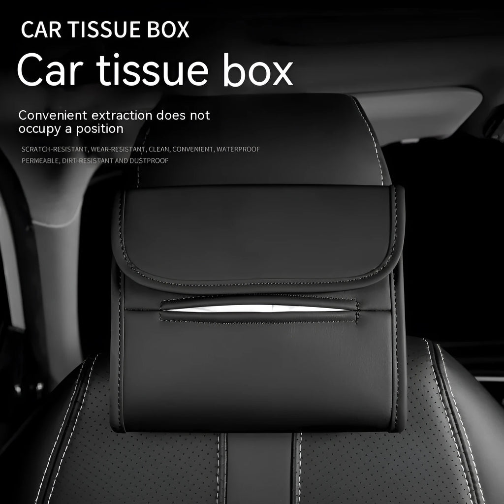 Brown leather car tissue box with elastic band hanging from a car sun visor