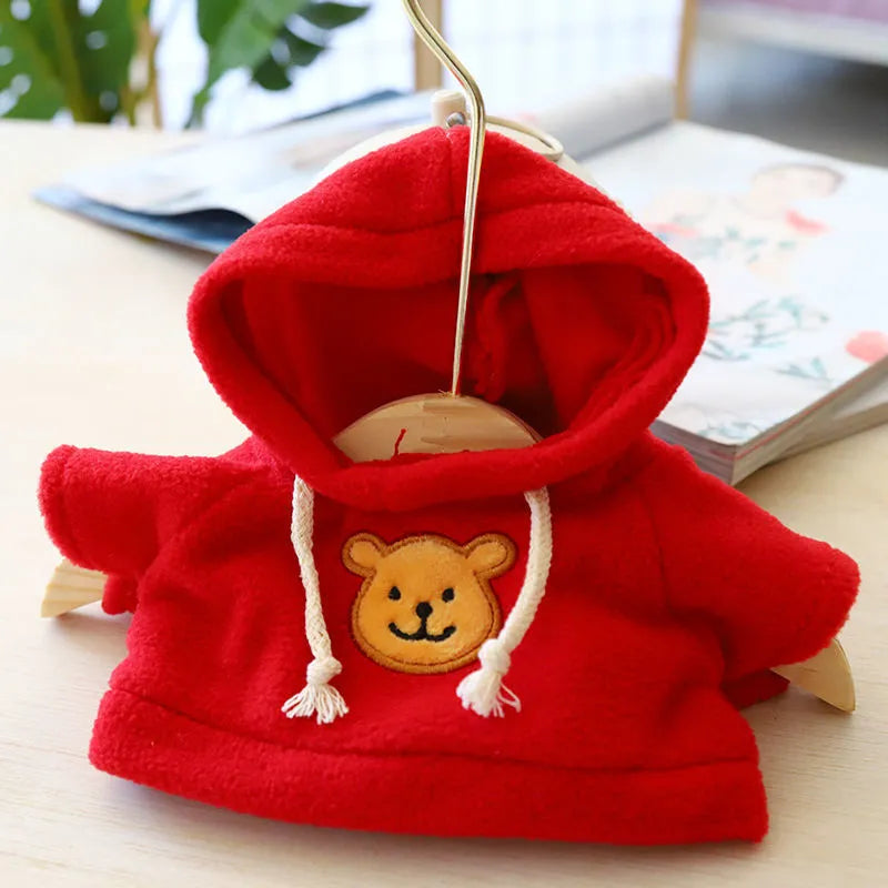 A dog wearing a blue hooded sweater, with size options of 23cm medium and 42cm large available.