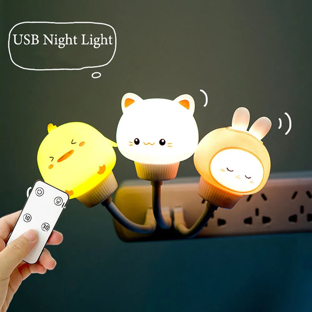 USB portable LED night light in cartoon bear shape with remote control on wooden table.