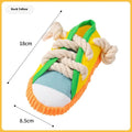 Plastic dog chew toy in three colours with bendable design and sound mechanism