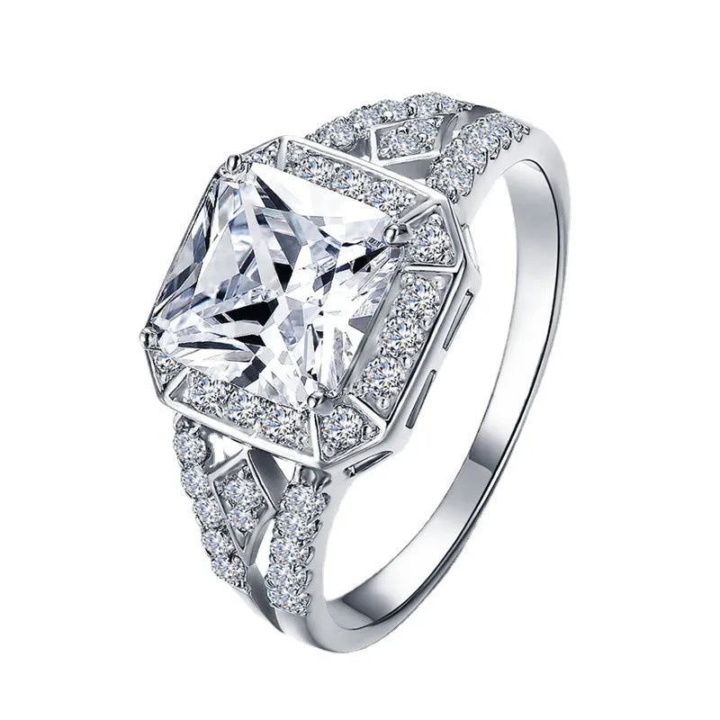 Women's geometric hollow zircon ring in platinum colour showing quadrilateral design and inlaid stones
