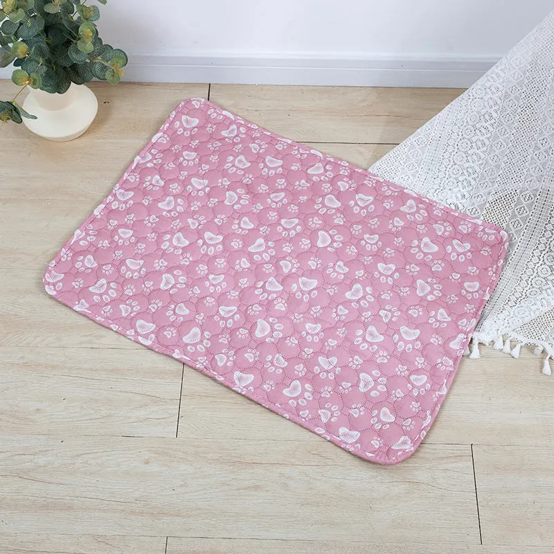 Reusable cloth pet urine pad with colourful animal print and waterproof backing.
