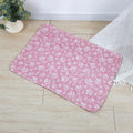 Reusable cloth pet urine pad with colourful animal print and waterproof backing.