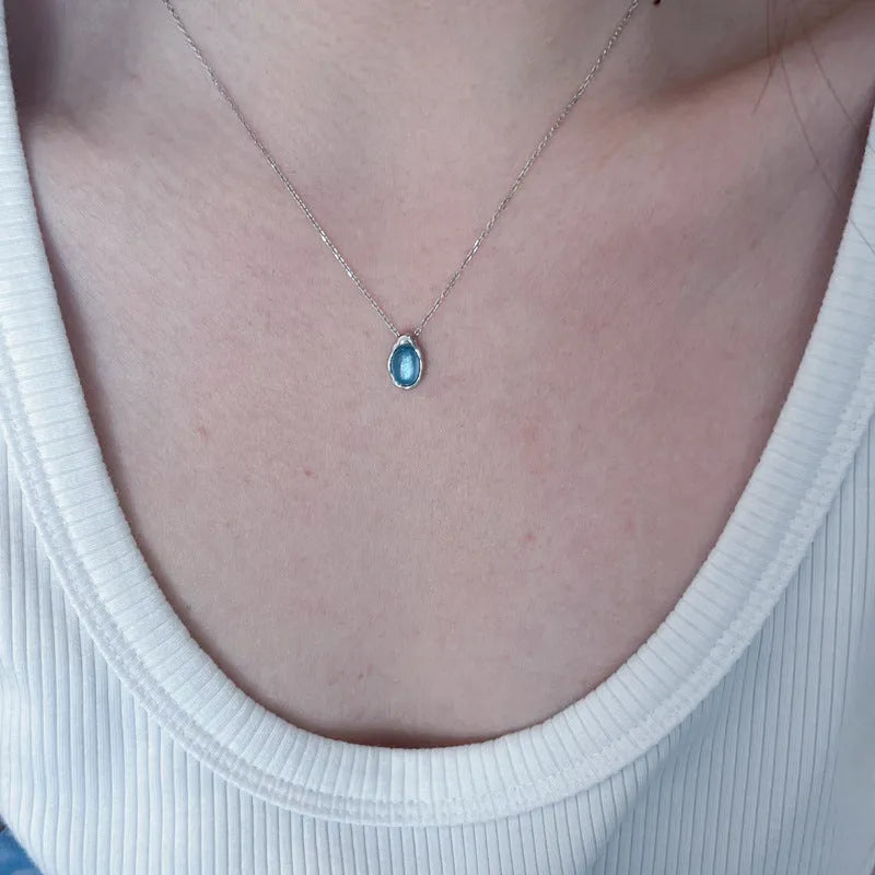 Women's navy blue water drop pendant necklace with geometric copper pendant and cross chain design