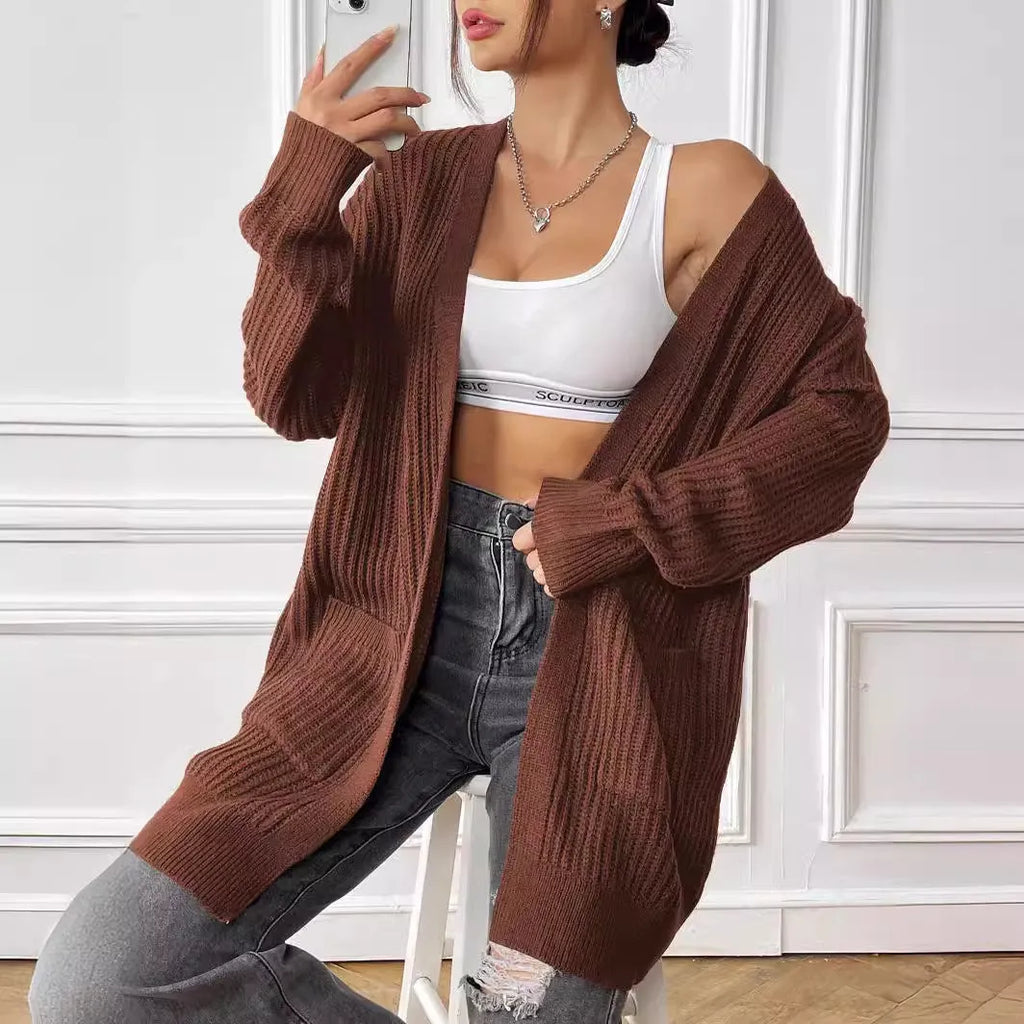 Women's mid-length loose-fit acrylic cardigan in dark green, shown as a single piece with long sleeves.