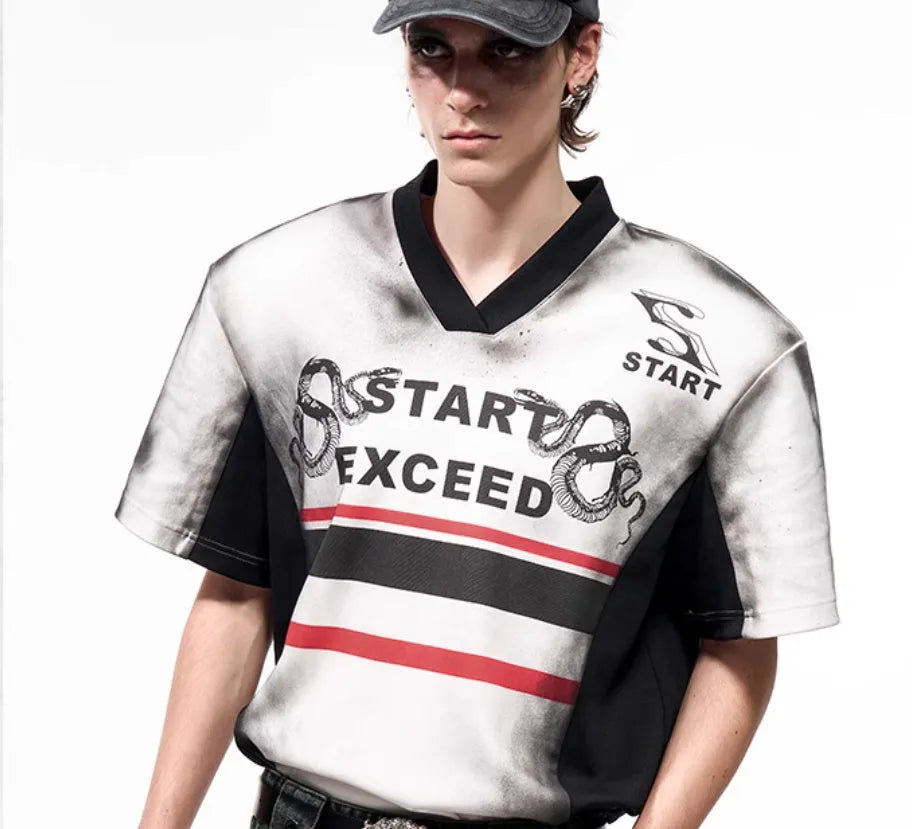 Women's V-neck short-sleeved top with a grey letter snake pattern print and padded shoulders.