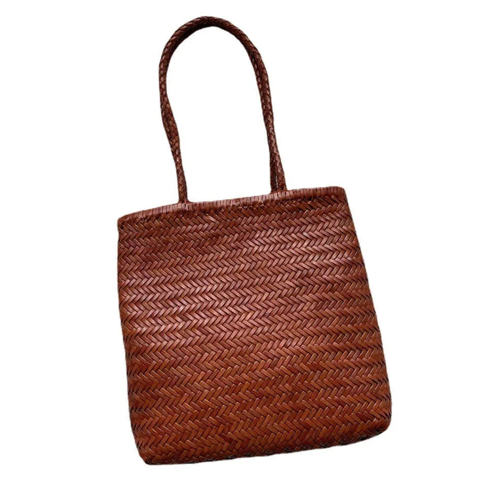 Brown handmade woven tote bag with three-dimensional pocket made from cowhide leather