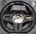 Black carbon fibre sports steering wheel with LED display for BMW X3 and X5 cars.