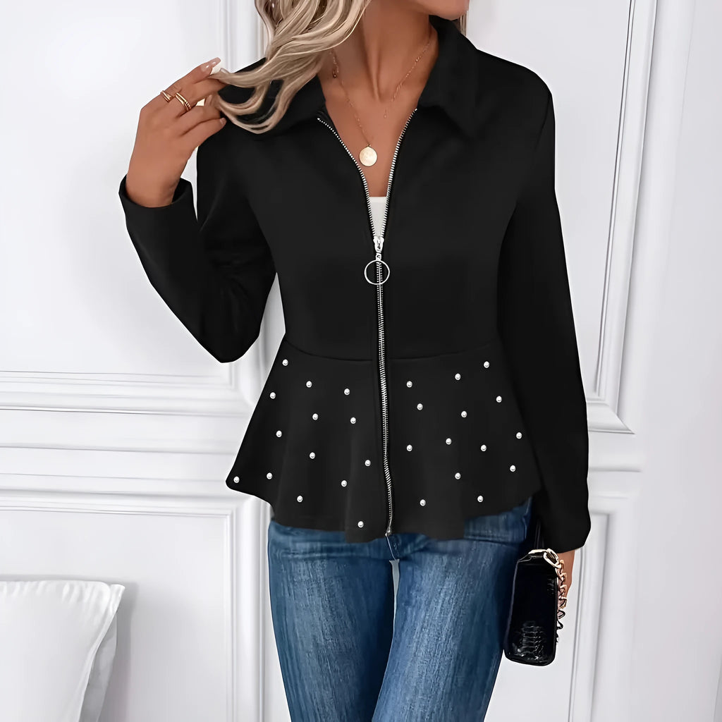 Women's black loose fit coat with beaded heavy-duty zipper and ruffled hem detail.