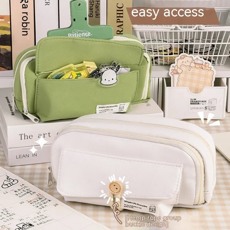 Canvas button-closure pencil case in beige, shown open with pens inside, demonstrating its large capacity.