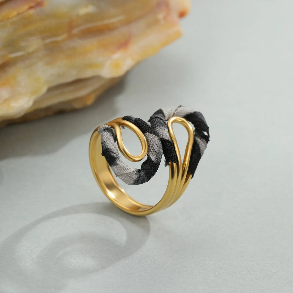 Geometric leopard print open mouth ring in stainless steel, shown in various colour options.