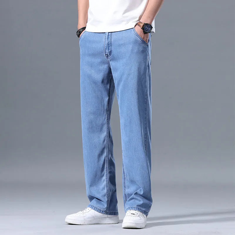 Men's loose straight-leg lyocell jeans in light blue colour showing front view with zipper fly