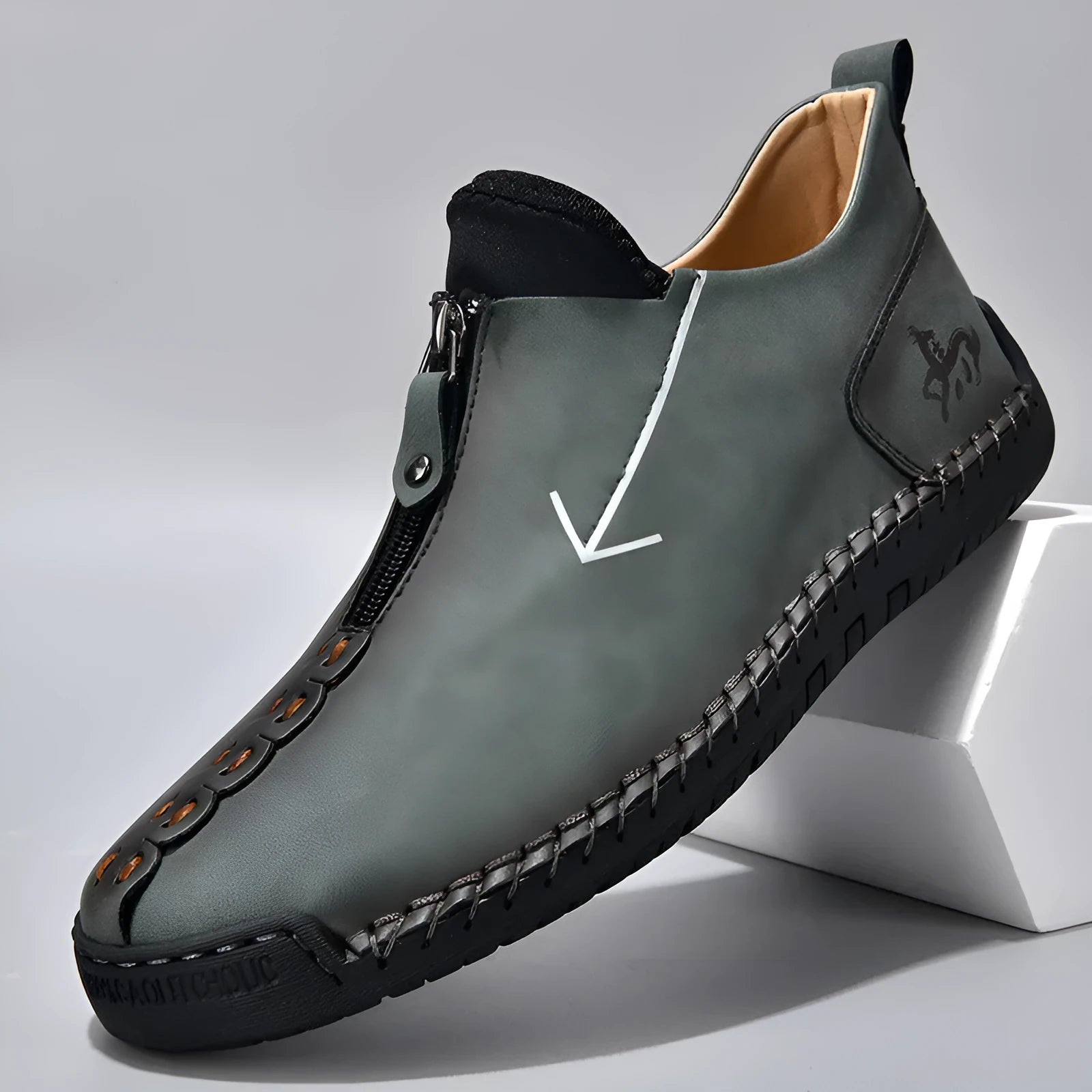 Men's black leather boots with front zipper and hand-stitched detailing, mid-calf height with low rubber sole