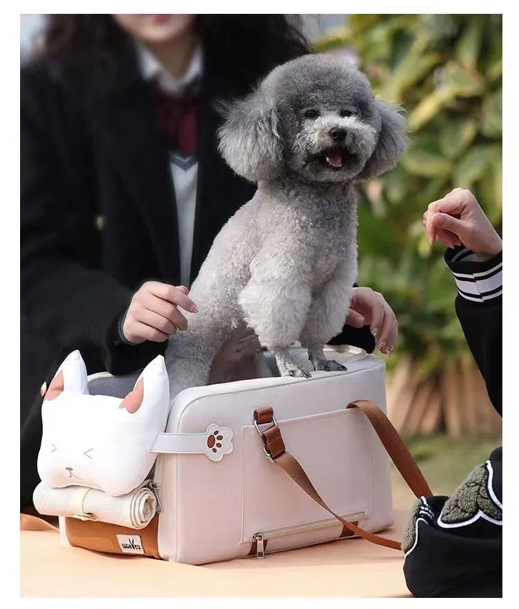 Beige hard-shell pet flight case with one-shoulder strap for cats and small dogs