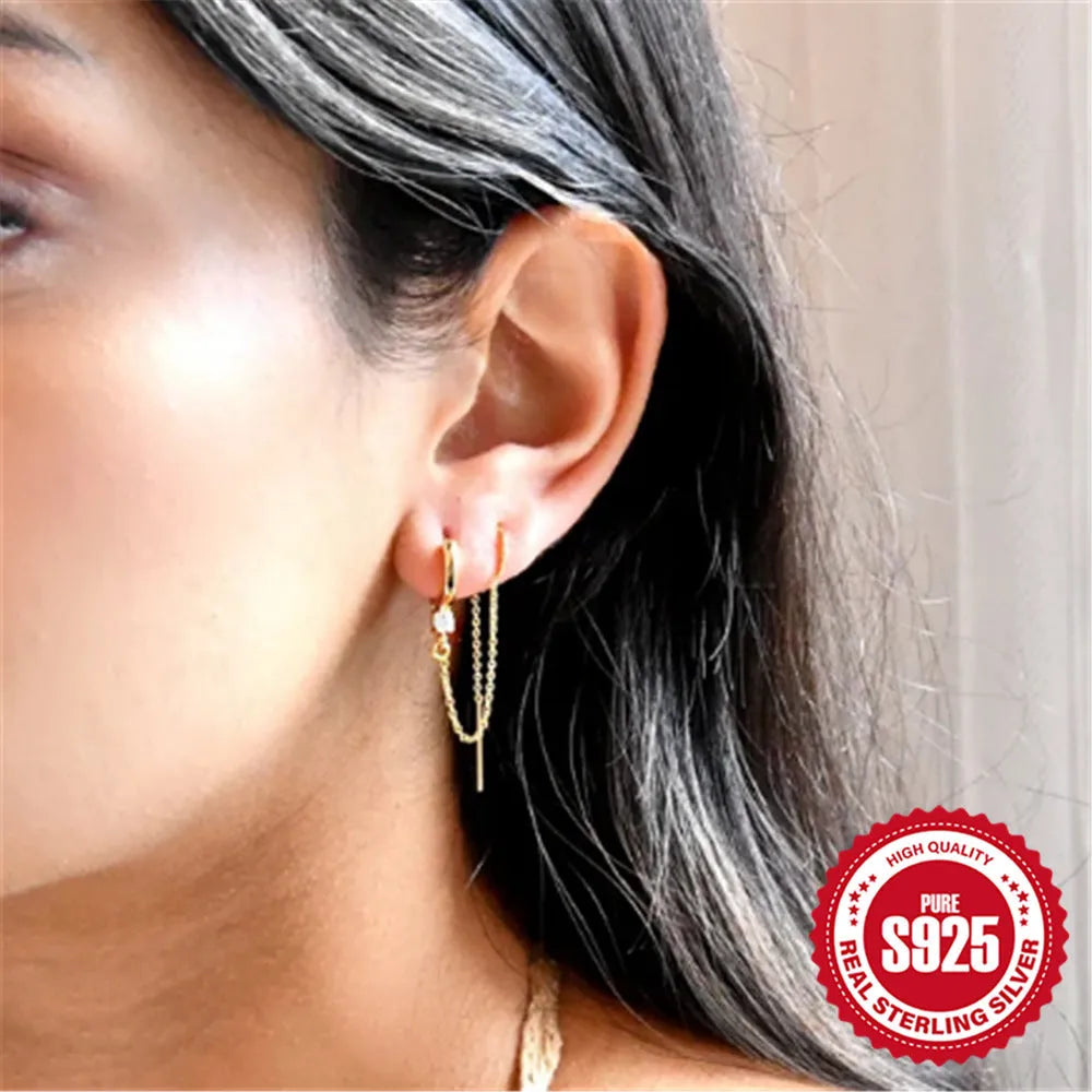 S925 sterling silver geometric ear studs with diamond flower, tassel, and chain design in electroplated gold.