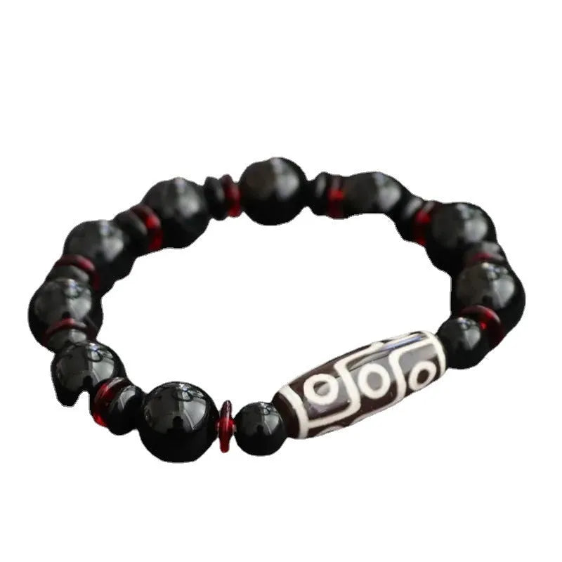 Black agate dzi bead bracelet with chalcedony stones and hand-woven design