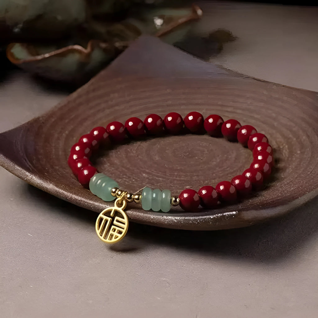 Handmade wave-shaped bracelet made from cinnabar and copper beads in a national unisex style.