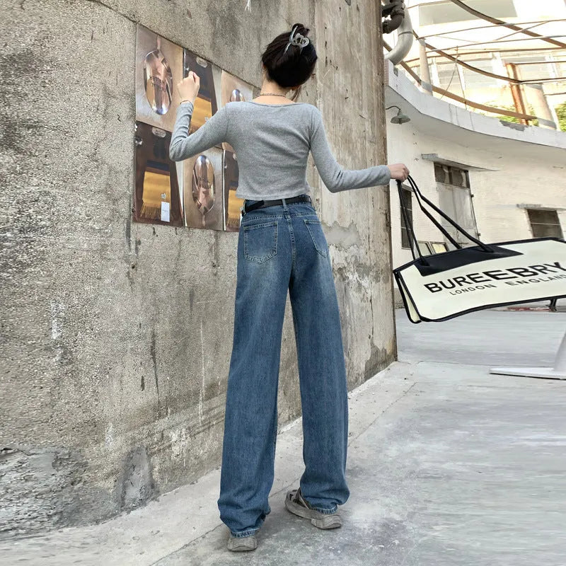 Women's high-waist retro blue straight-leg jeans on a model, showing the classic fit.