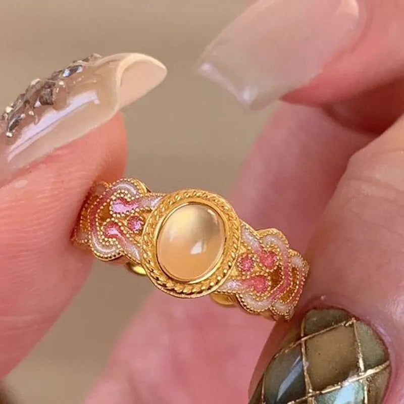 Pink crystal enamel geometric open ring on gold-plated copper band with adjustable cuff design