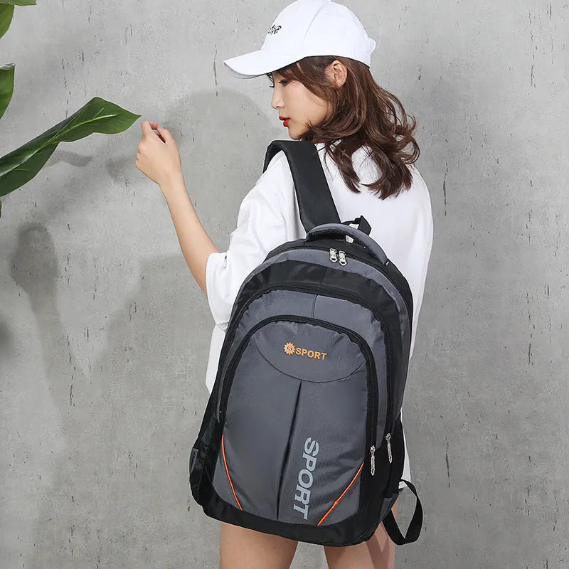 Breathable nylon backpack for men with 20-35L capacity, curved shoulder strap, and letter design in gray