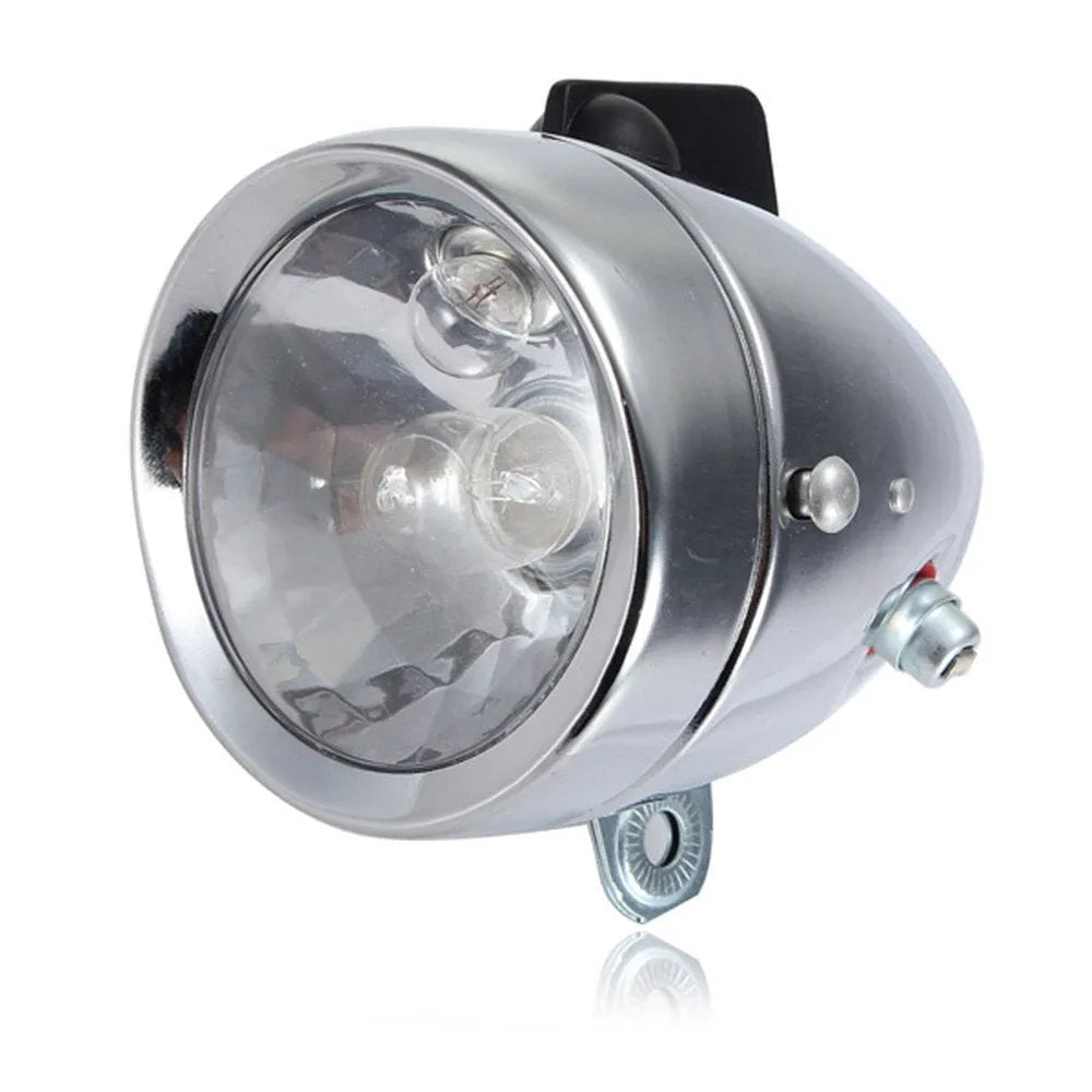 Silver bicycle dynamo-powered generator light set for front and rear bike lighting.
