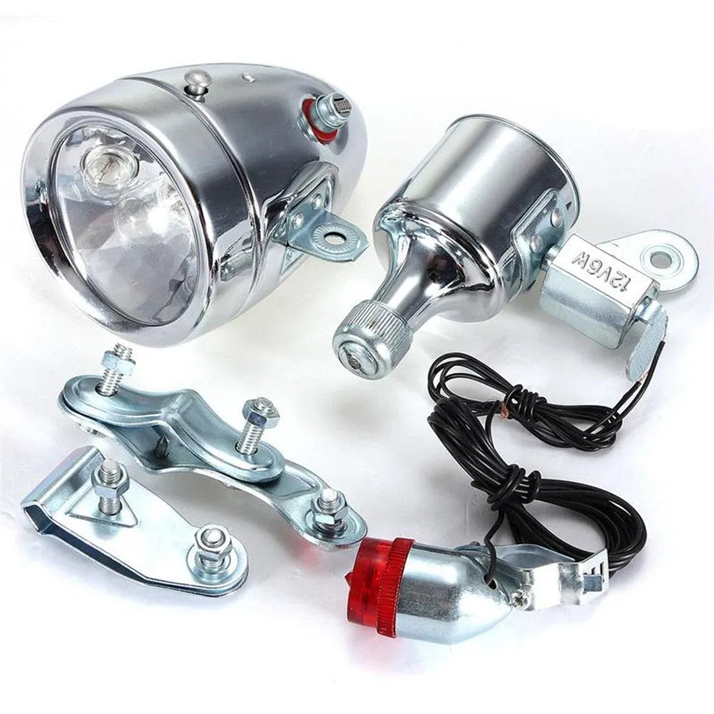 Silver bicycle dynamo-powered generator light set for front and rear bike lighting.