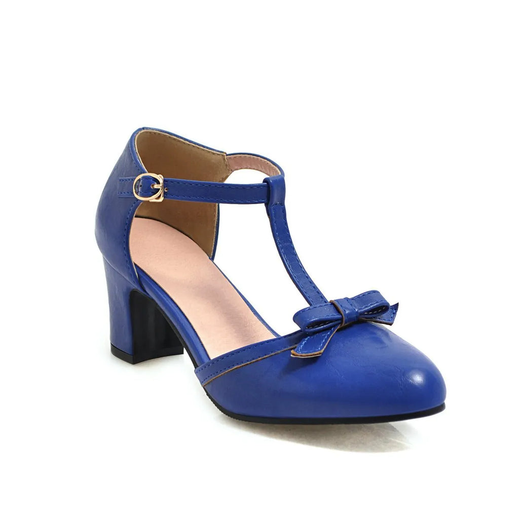 Women's apricot-colour sandals with a chunky heel, bow detail, and a hollow-out buckle strap on a round toe.