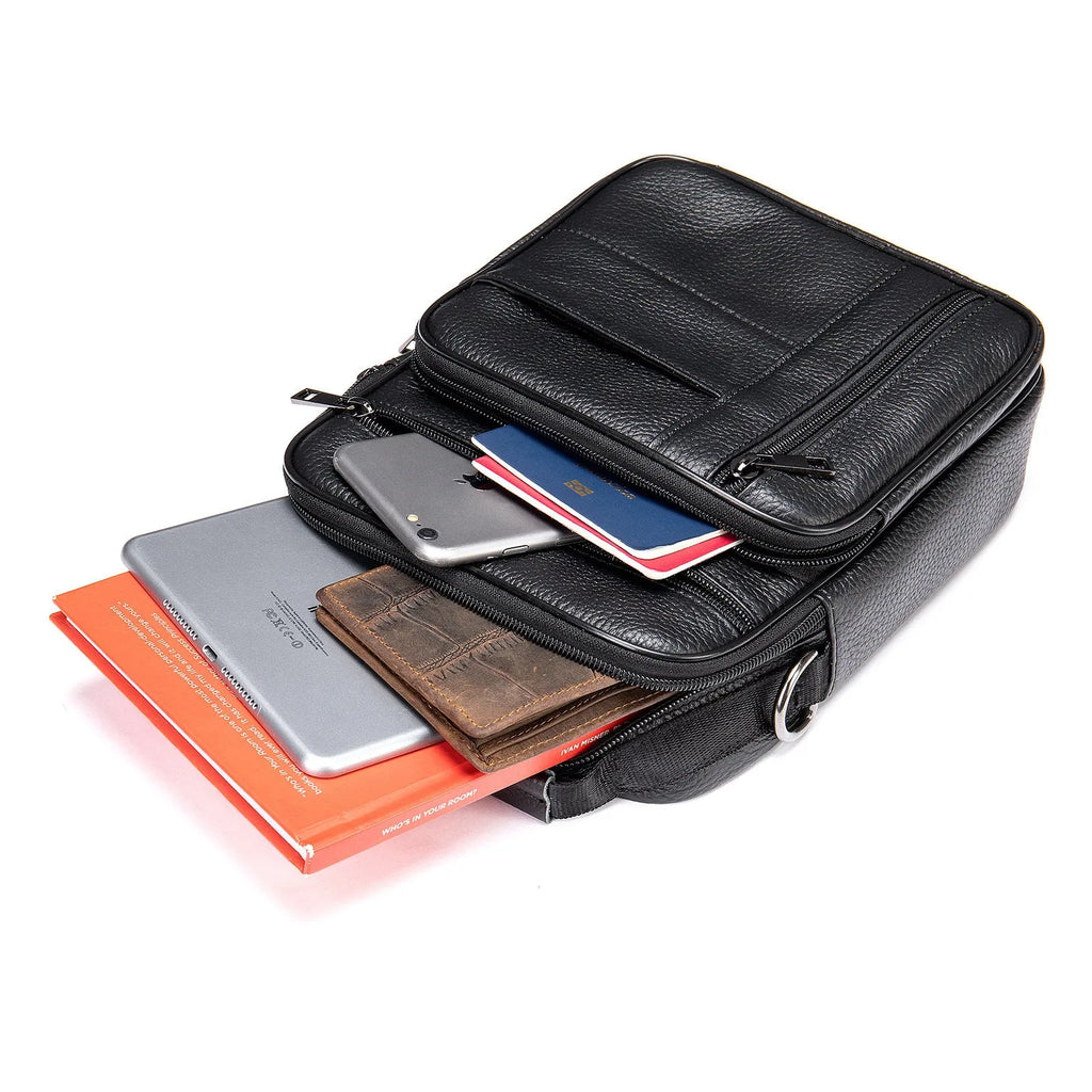 Men's vintage cowhide leather shoulder bag showing vertical square shape and internal organisation pockets