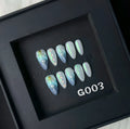 Blue summer design plastic false nail stickers in XS, S, M, L sizes.