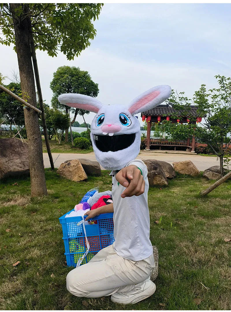 Long eared white rabbit plush cover on an electric motorcycle helmet.