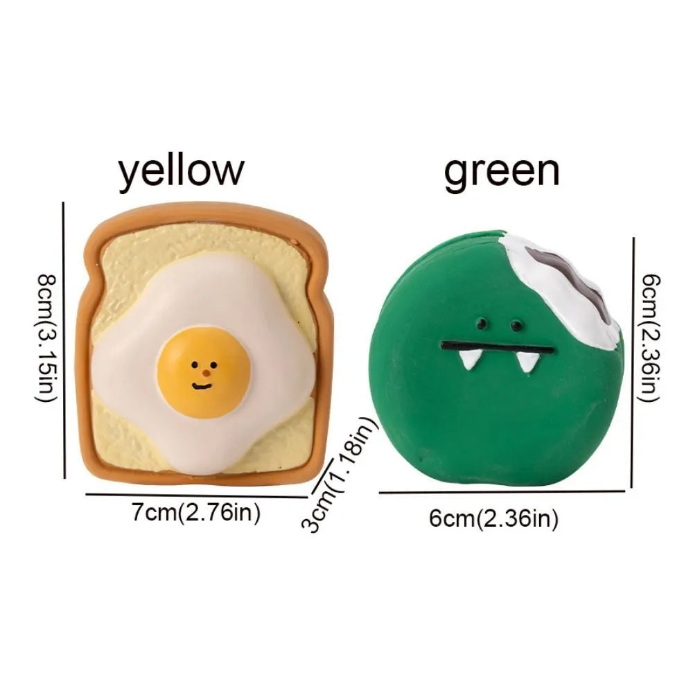 Yellow and green bread-shaped latex dog squeaky toy with cartoon pattern on a white background.