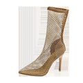 Gold women's high heel sandals with a mesh upper, pointed toe, and stiletto heel on a rubber sole.