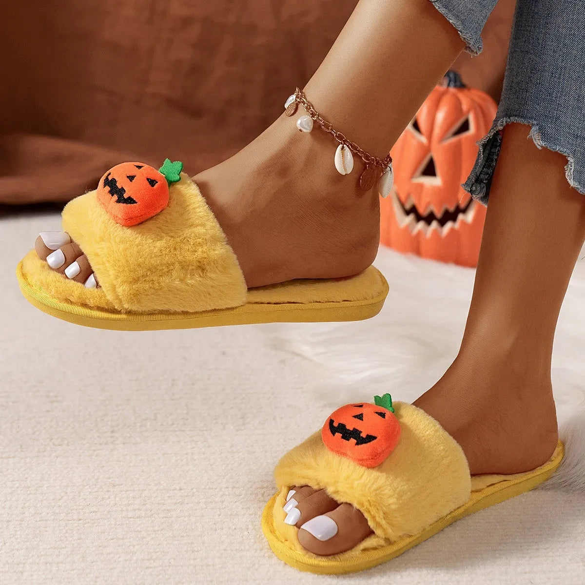 Yellow pumpkin cartoon plush slippers with synthetic fur upper and PVC sole, open toe design.