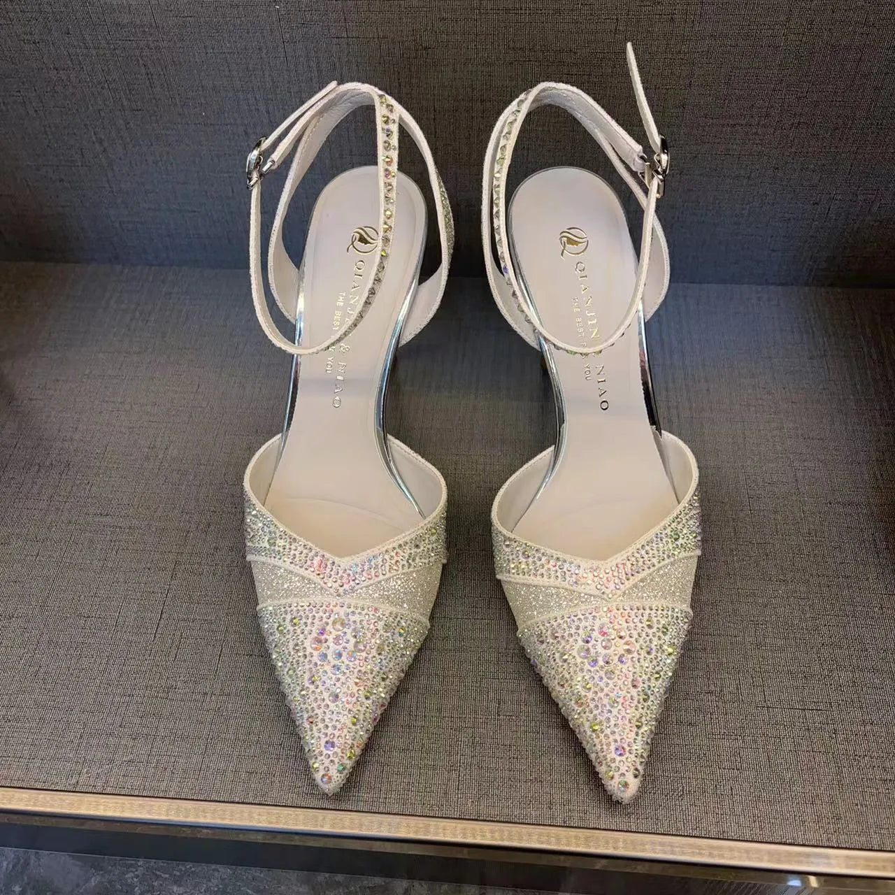 Women's hollow high heels with red sole and stiletto heel in black or silver colours