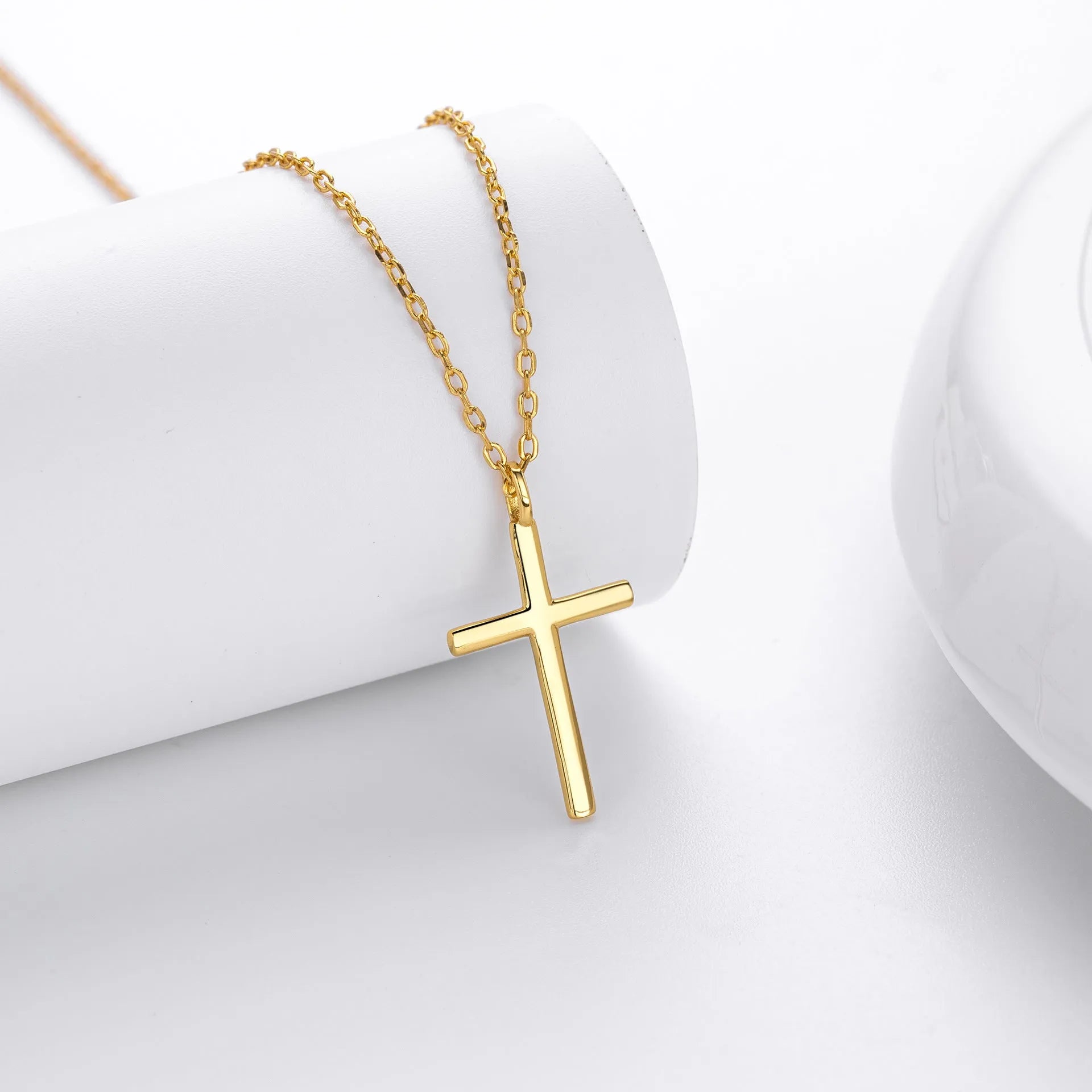 Sterling silver necklace with simple cross pendant on adjustable O-shaped chain in gold, platinum, or rose gold finish