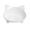 Shallow black or white melamine cat bowl with a non-slip rubber base on a table.
