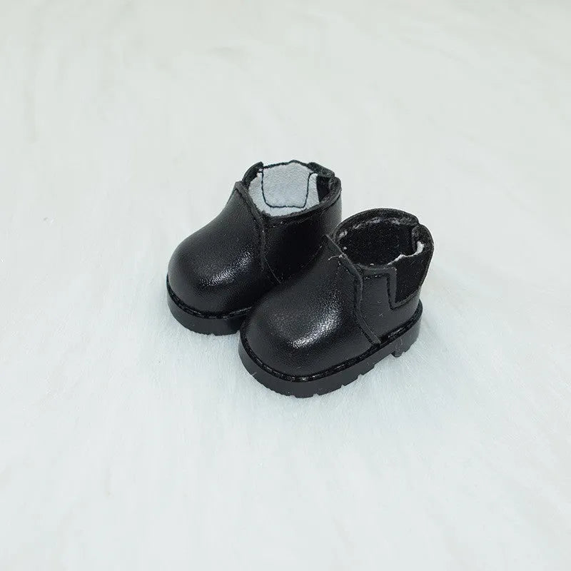 A pair of small black boots for a 17cm fashion doll, an example from the 18-style replacement shoe collection.
