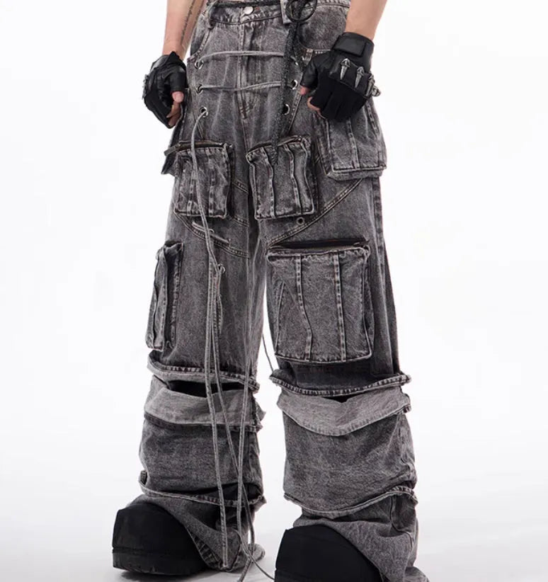 Grey denim distressed overalls with rope stitching and a wide-leg mop pants silhouette.