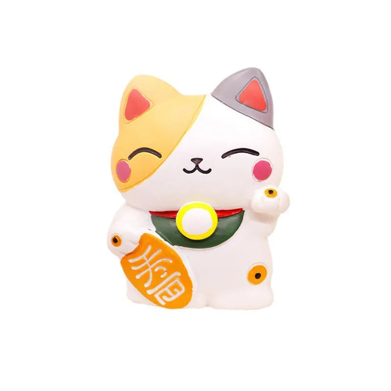 Black cat and white cat resin car vent clip aromatherapy diffuser on a car air conditioning vent.