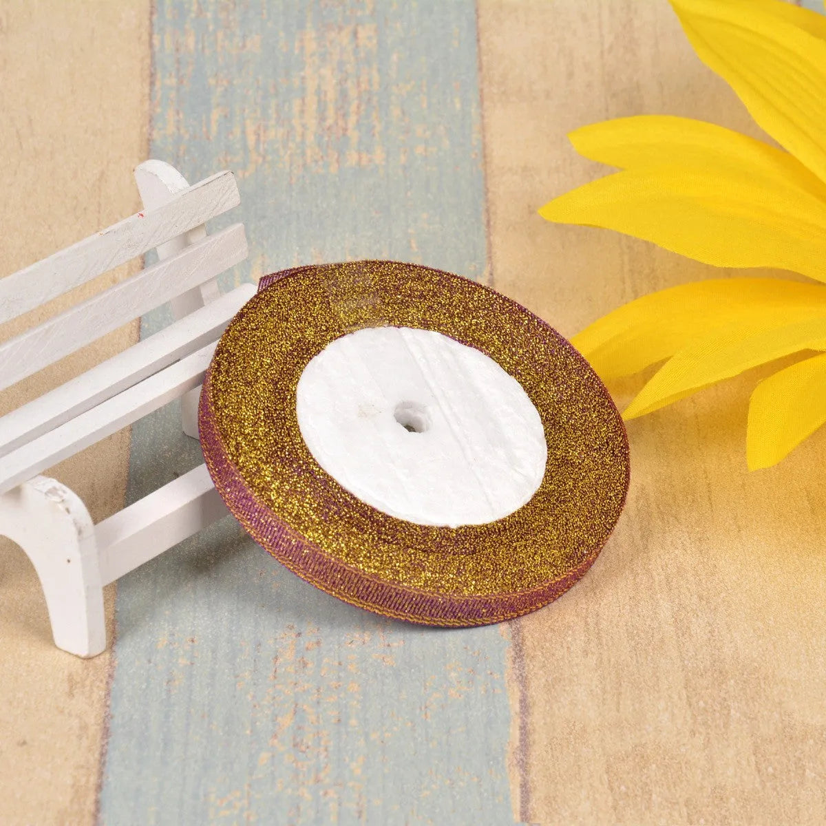Green onion coloured polyester ribbon with gold polka dots on 25-yard spool for decorative trimming