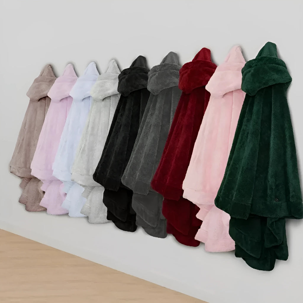 A thick pink hooded bathrobe with long sleeves and a cardigan-style front, laid flat.